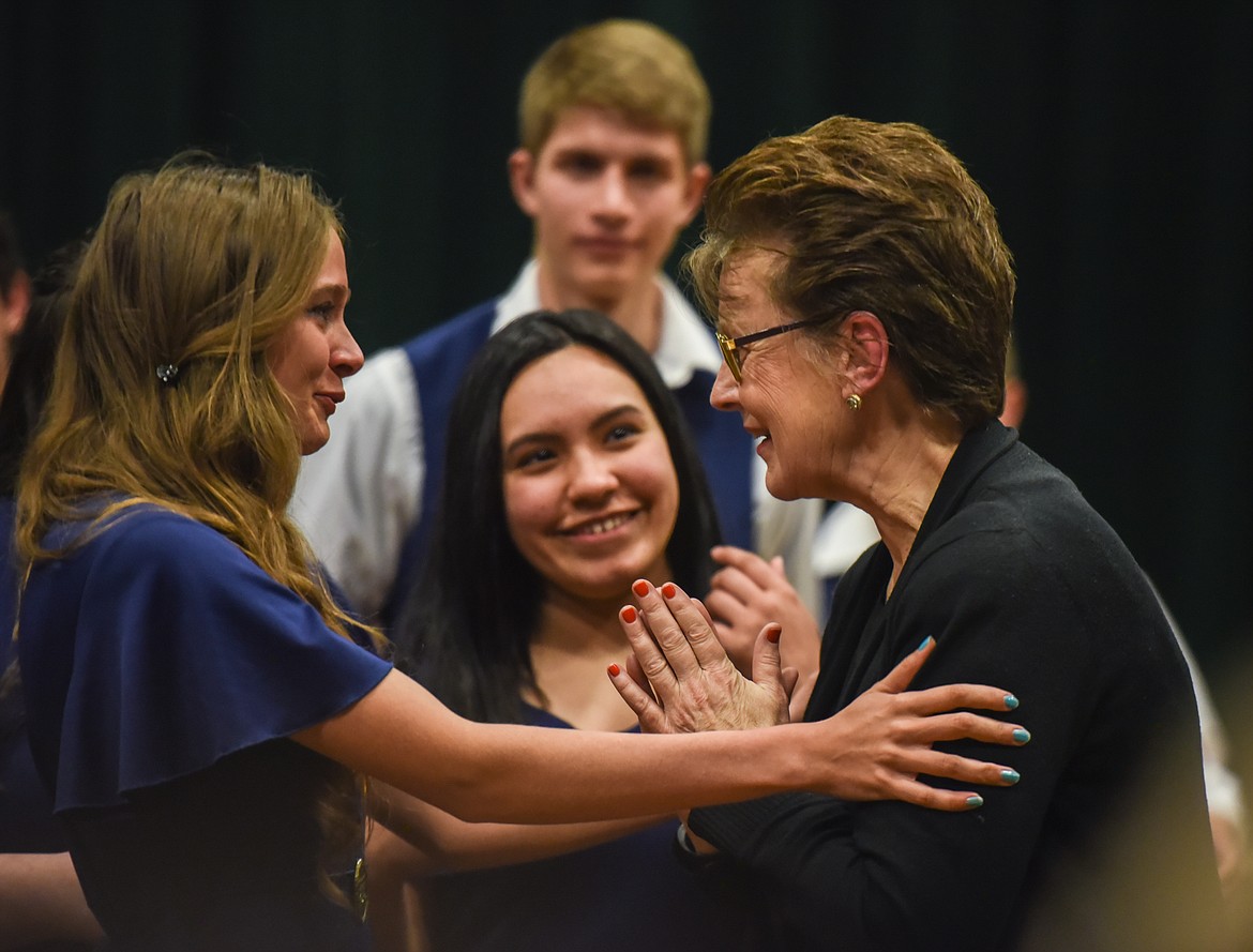 TOP: Mikalyn Zeiler, left, embraces Lorraine Braun after thanking her for her years of work with Libby students, Tuesday at the Libby Memorial Events Center. (Luke Hollister/The Western News)