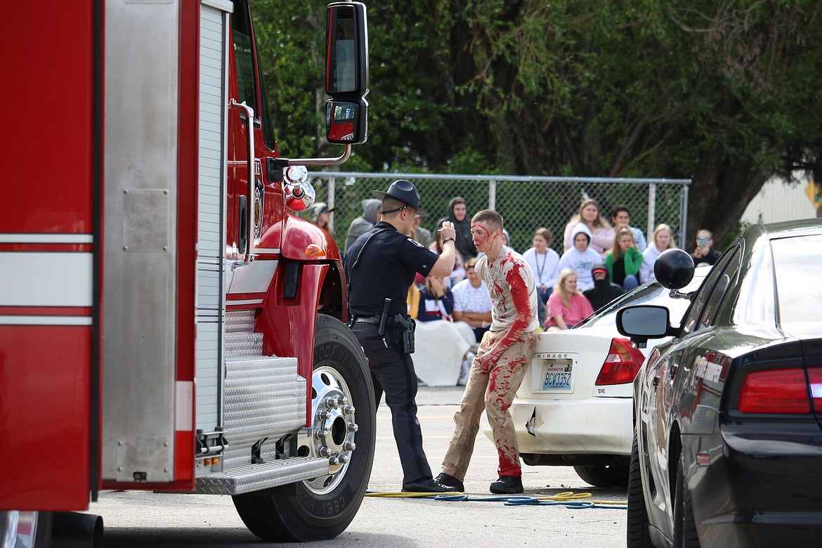 (Photo by MARY MALONE)
Lake Pend Oreille High School senior Mason Deal is given a series of tests to determine if he is intoxicated during the mock DUI scenario, &quot;Operation Grad Night,&quot; Tuesday at Sandpoint High School.