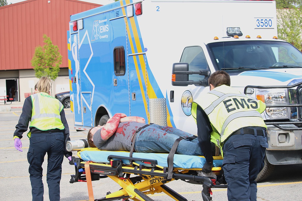 (Photo by MARY MALONE)
Priest River Lamanna High School senior Max Bombino is transported to an ambulance during the mock DUI scenario, &quot;Operation Grad Night,&quot; Tuesday at Sandpoint High School.