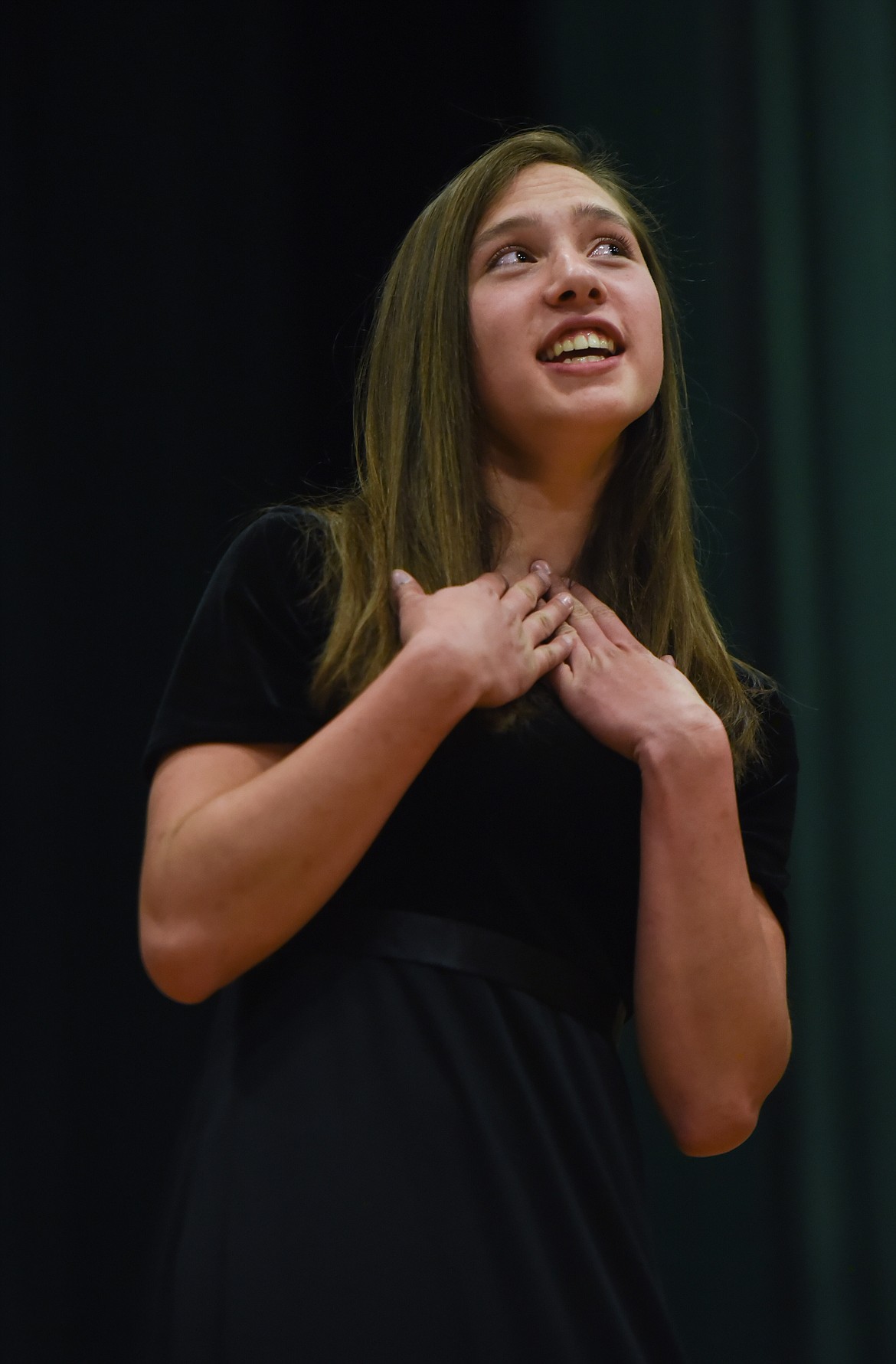 LEFT: Samantha Newton sings a solo while performing American Folk Suit with the Libby Middle School Honors Choir, Tuesday at the Libby Memorial Events Center. (Luke Hollister/The Western News)