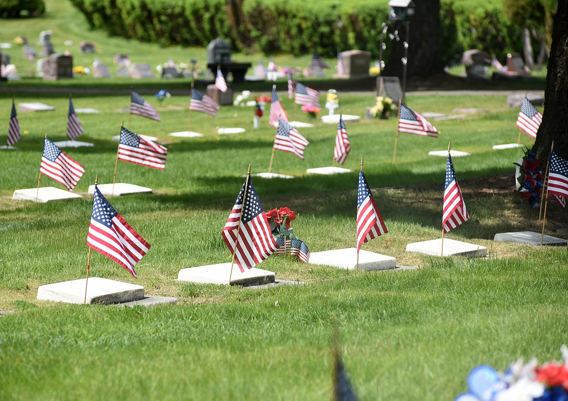 Flags mark graves at the Whitefish Cemetery on Memorial Day. (Heidi Desch/Whitefish Pilot)