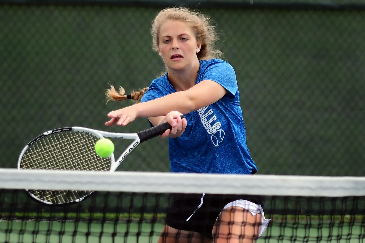 Hannah Schweikert makes a lunging play on the ball against Whitefish&#146;s Lauren Brown in the first round of the Western A Divisional Tennis Tournament at FVCC Wednesday. (Jeremy Weber photo)