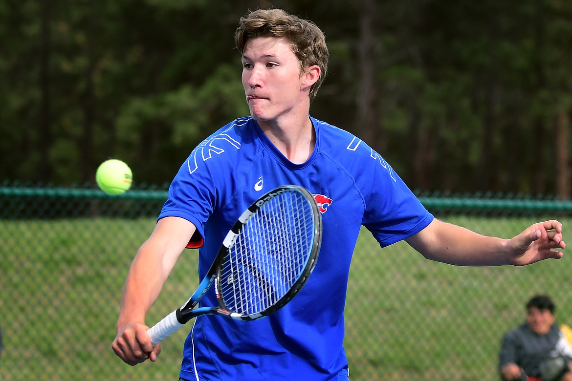 Niels Getts hits a backhand shot against Ronan&#146;s Colby Delvin at Western A Divisional Tennis Tournament at FVCC Wednesday. (Jeremy Weber photo)