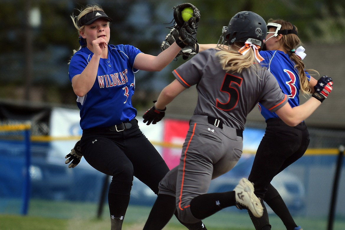 Columbia Falls shortstop Trista Cowan makes a play on Frenchtown baserunner Layne Bauer in the second inning Tuesday.