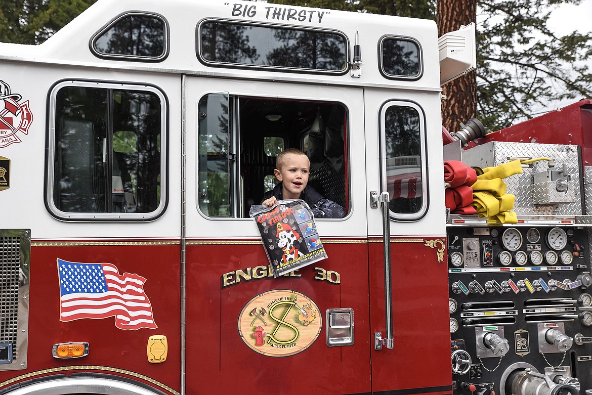Gavin Pape checks out the Libby Volunteer Fire Department&#146;s Engine 30 at the Kootenai Kiwanis Family Fun Day at Fireman&#146;s Park in Libby last Saturday. (Ben Kibbey/The Western News)