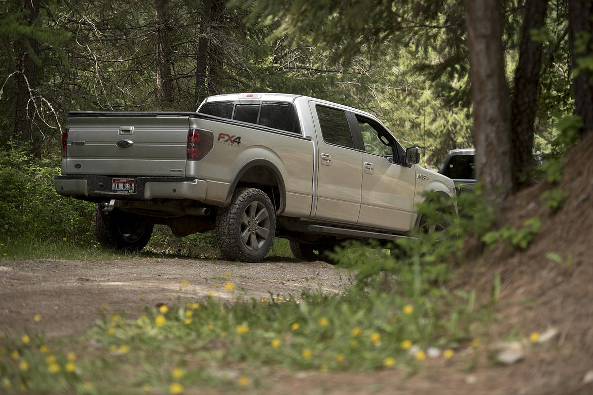 The stolen pickup sits near Lake Creek Road after being left there by the driver, Tuesday. (Luke Hollister/The Western News)