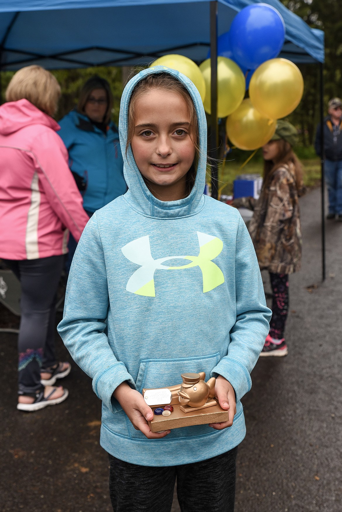 Cyleigh Parker with her trophy for the 9-to-11 age group, at the Lil&#146; Anglers Fishing Day at the Mill Pond on Saturday (Ben Kibbey/The Western News)