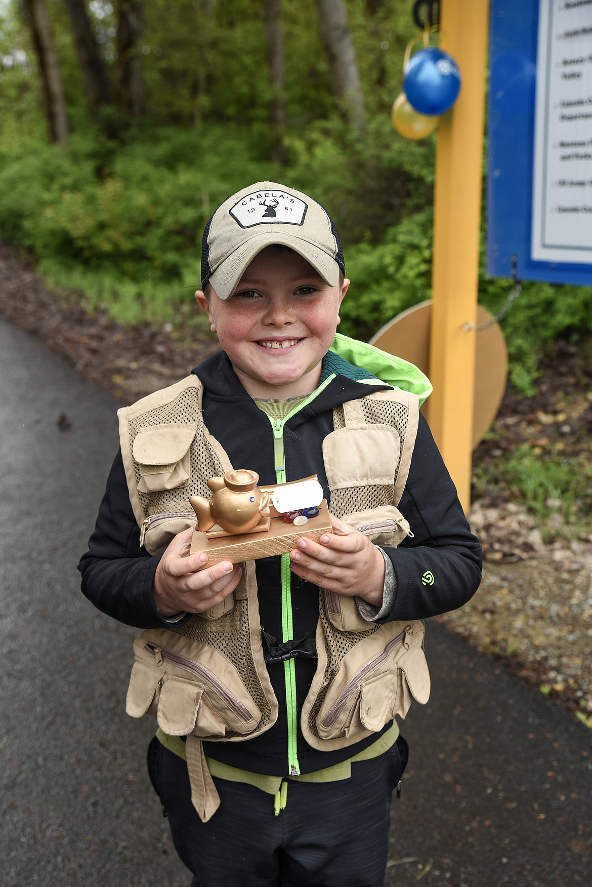 Liam Sunell with his trophy for the 6-to-8 age group at the Lil&#146; Anglers Fishing Day at the Mill Pond on Saturday (Ben Kibbey/The Western News)