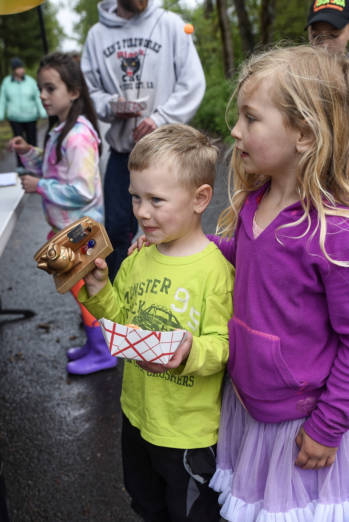 John Deitrick stands with Gabby Deitrick after collecting his trophy for the 2-to-5 age group, at the Lil&#146; Anglers Fishing Day at the Mill Pond on Saturday (Ben Kibbey/The Western News)