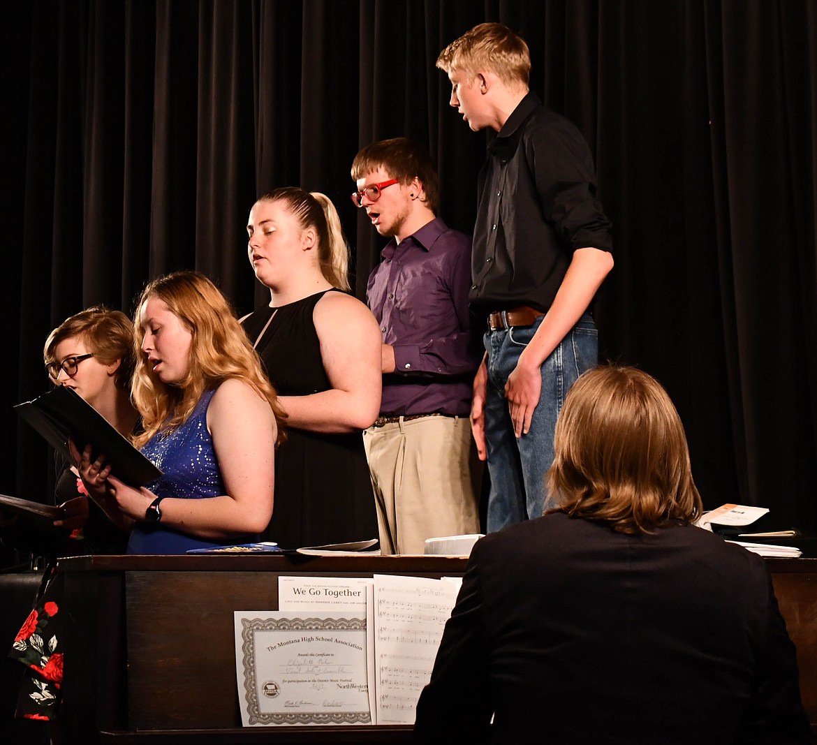 KIM PARSONS, Elizabeth Nelson, McKenzie Stortz, Thomas Sayer and  Andrew Sanford sing at the Spring Concert. Derek and Shelley Larson play the piano. (Courtesy photo)