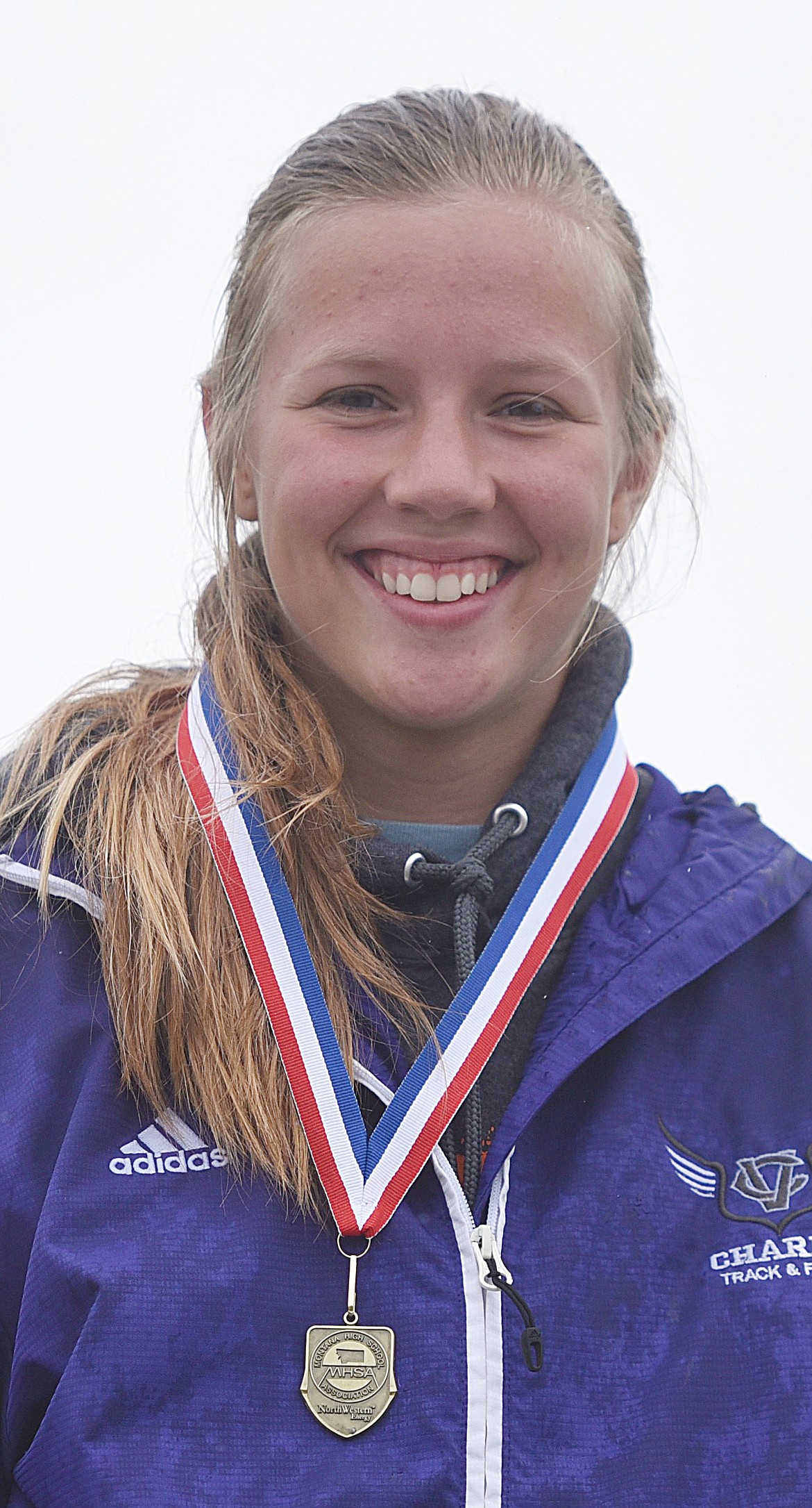 CHARLO HIGH School&#146;s Carlee Fryberger displays her medals at the conclusion of Western Class C Divisionals Thursday and Friday at MCPS Stadium. (photos by Joe Sova and Maggie Dresser/Lake County Leader, VP-Mineral Indepedent)