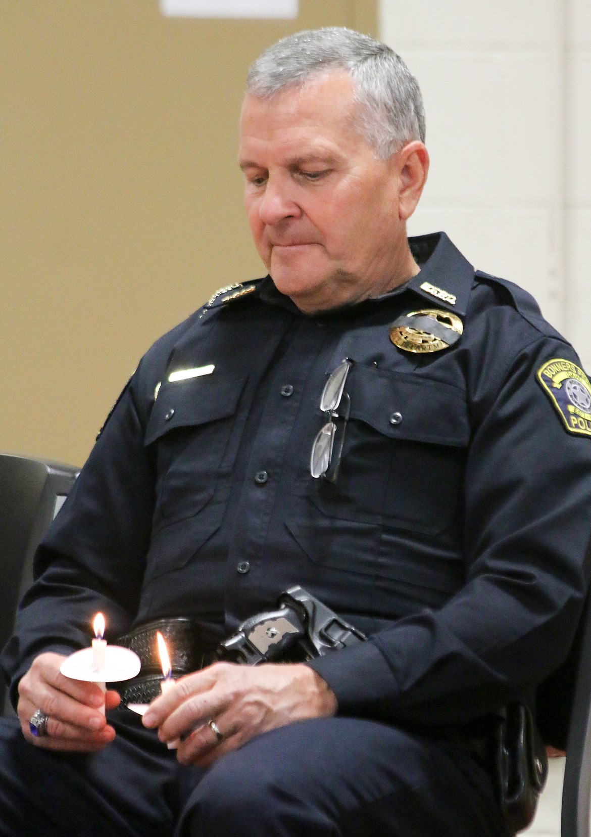 Photo by MANDI BATEMAN
Bonners Ferry Police Chief Brian Zimmerman holds his candle during the ceremony.