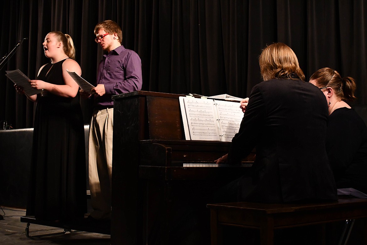 McKENZIE STORTZ and Thomas Sayer sing while Derek and Shelly Larson play the piano. (Courtesy photo)