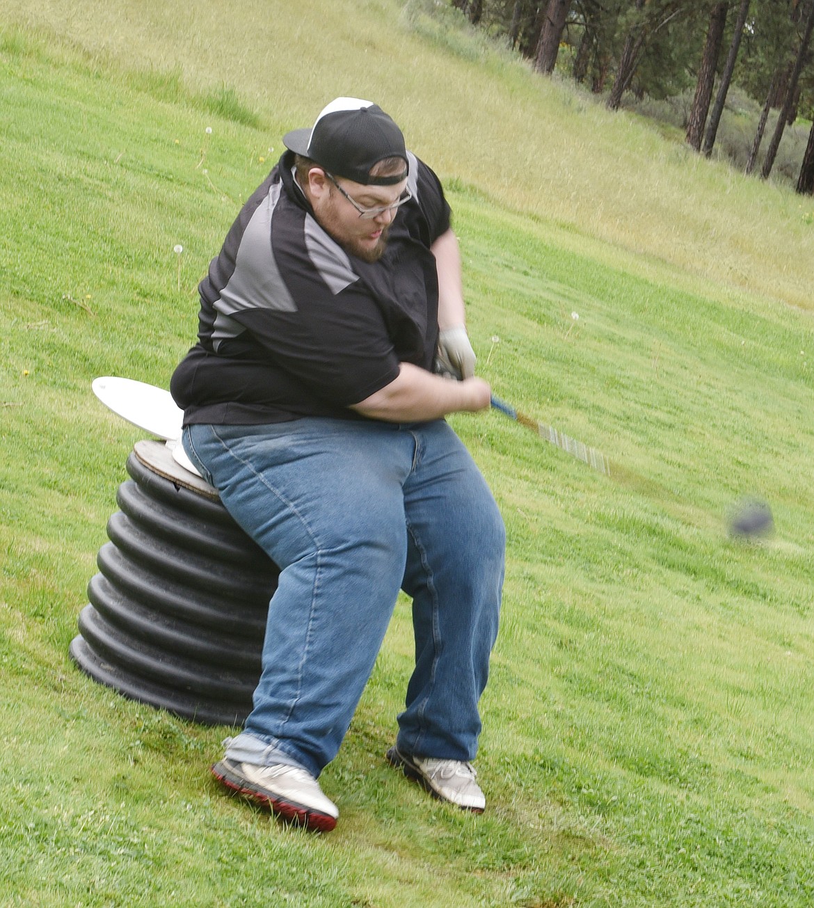 SHAWN &#147;JUMBO&#148; Bright gets a good swing from the infamous toilet seat. This was Jumbo&#146;s 12th Hack and Blast, which he has attended since he was 18.