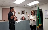 Warden swears in new police officer
