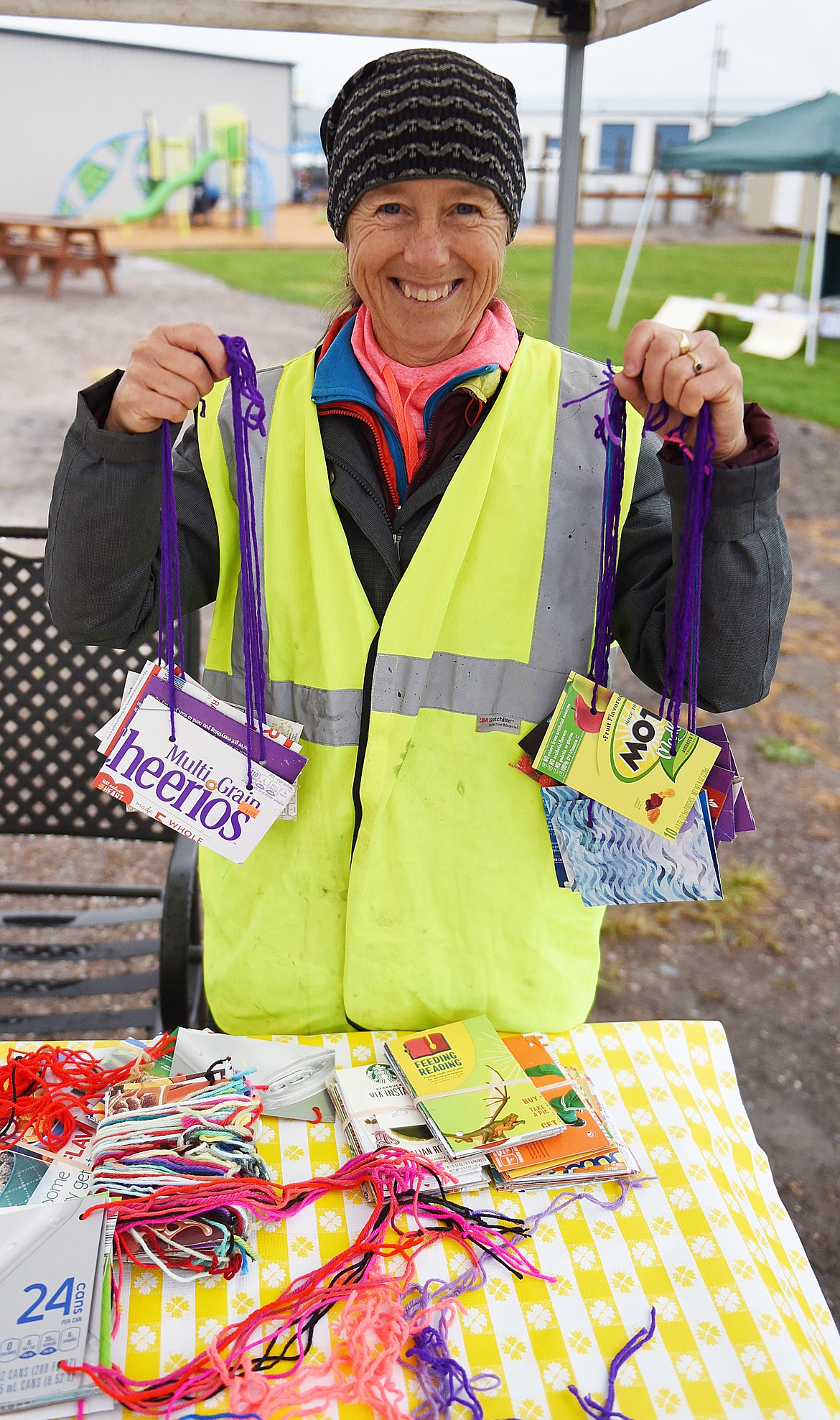 JANET SUCHA shows the placards that rides wore during the fun-day ride.