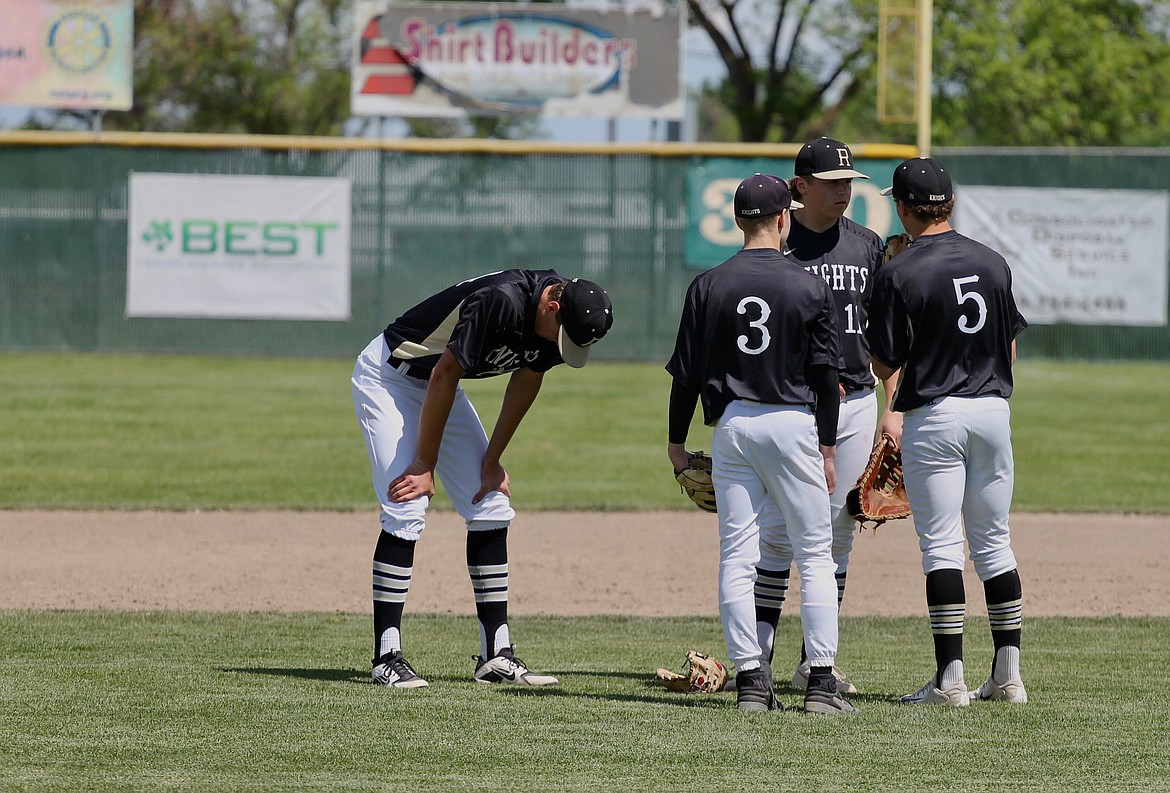 Casey McCarthy/ Columbia Basin Herald  Royal pitcher Sawyer Jenks hangs his head after being pulled against Freeman in the Knights 10-1 defeat in the opening round of the 2A State tournament.