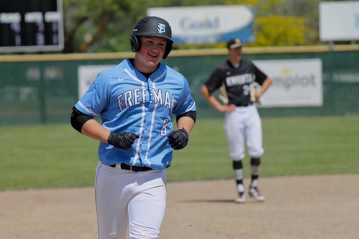 Casey McCarthy/ Columbia Basin Herald  Freeman's Jace Phelan smiles as he rounds the bases after a home run in the Scotties' 10-1 victory over Royal in the opening round of the 2A State tournament.