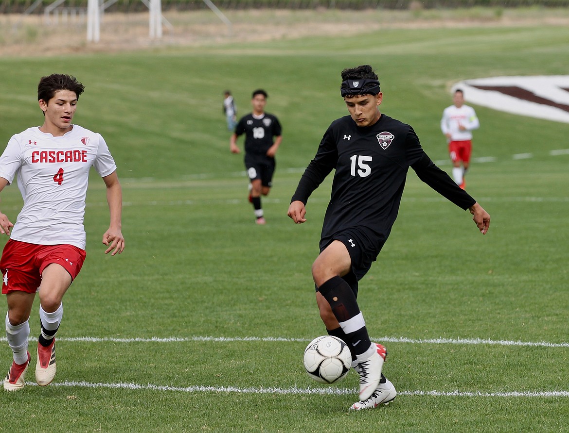 Casey McCarthy/ Columbia Basin Herald  Allen Contreras fires a shot for Wahluke in the first half of the State tournament game against Cascade on Tuesday in Mattawa. The Warriors were defeated 2-1 in extra time.