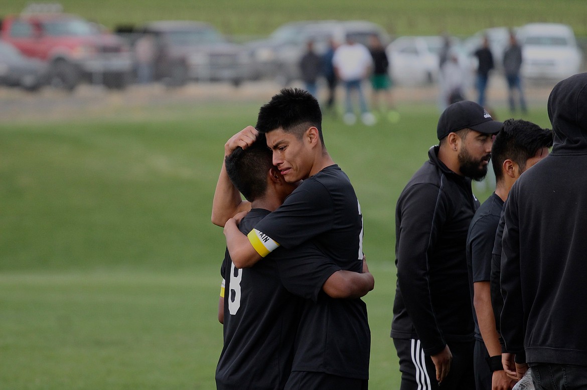 Casey McCarthy/ Sun Tribune
Wahluke midfielder William Dominguez embraces teammate Alejandro Rivera after the team&#146;s defeat in the opening round of the 1A State tournament in Mattawa.