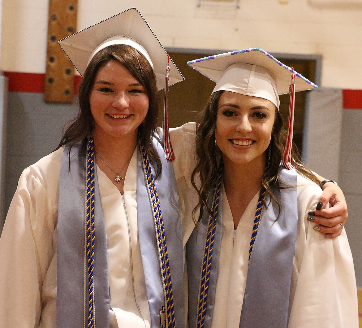 ARLEE SALUTATORIAN Ashley Potts, left, and valedictorian Noelle West stop for a photo after their graduation ceremony. (Photos courtesy of Color Wheel Photography)