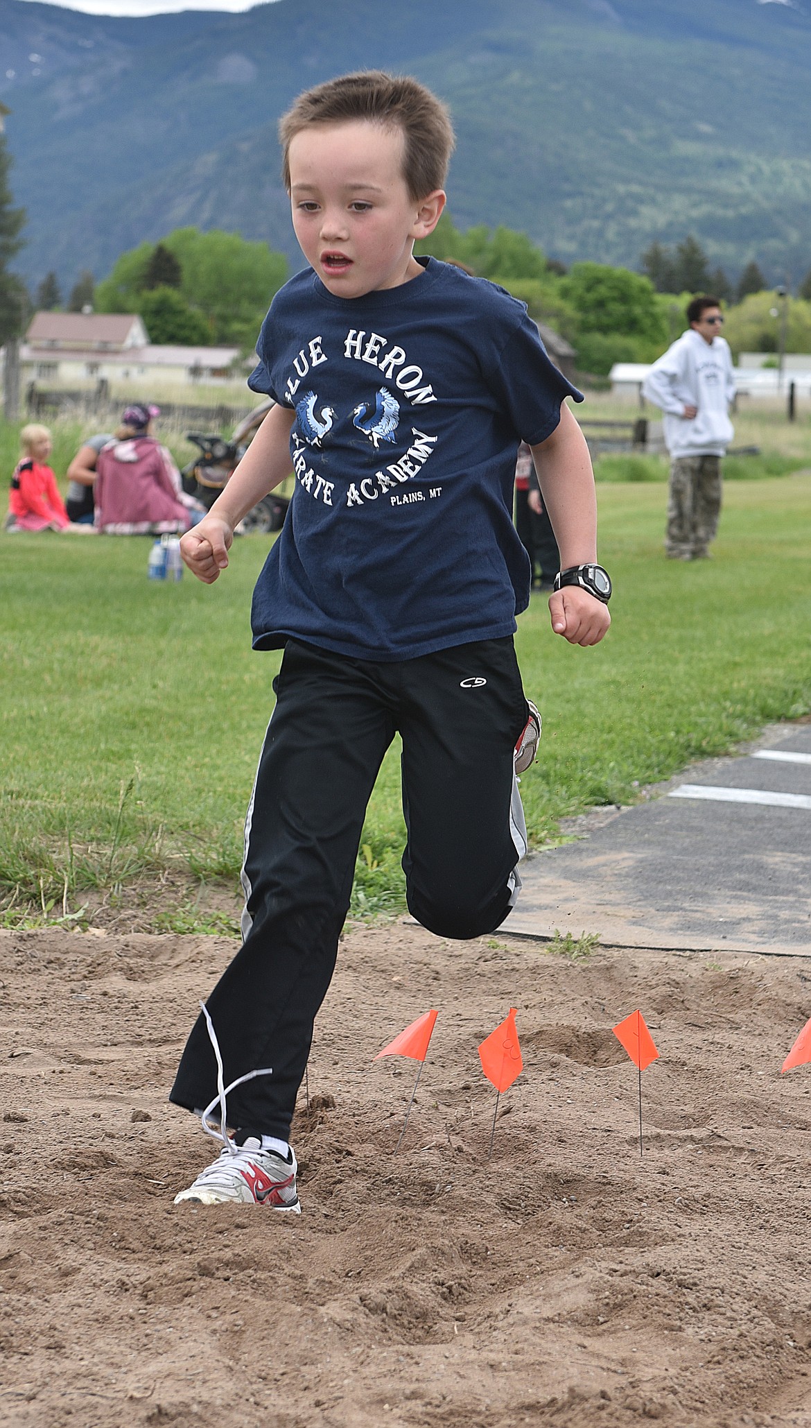 BEN TURNER, a kindergartner, does a run through during the long jump competition at Plains Elementary Track and Field Day.