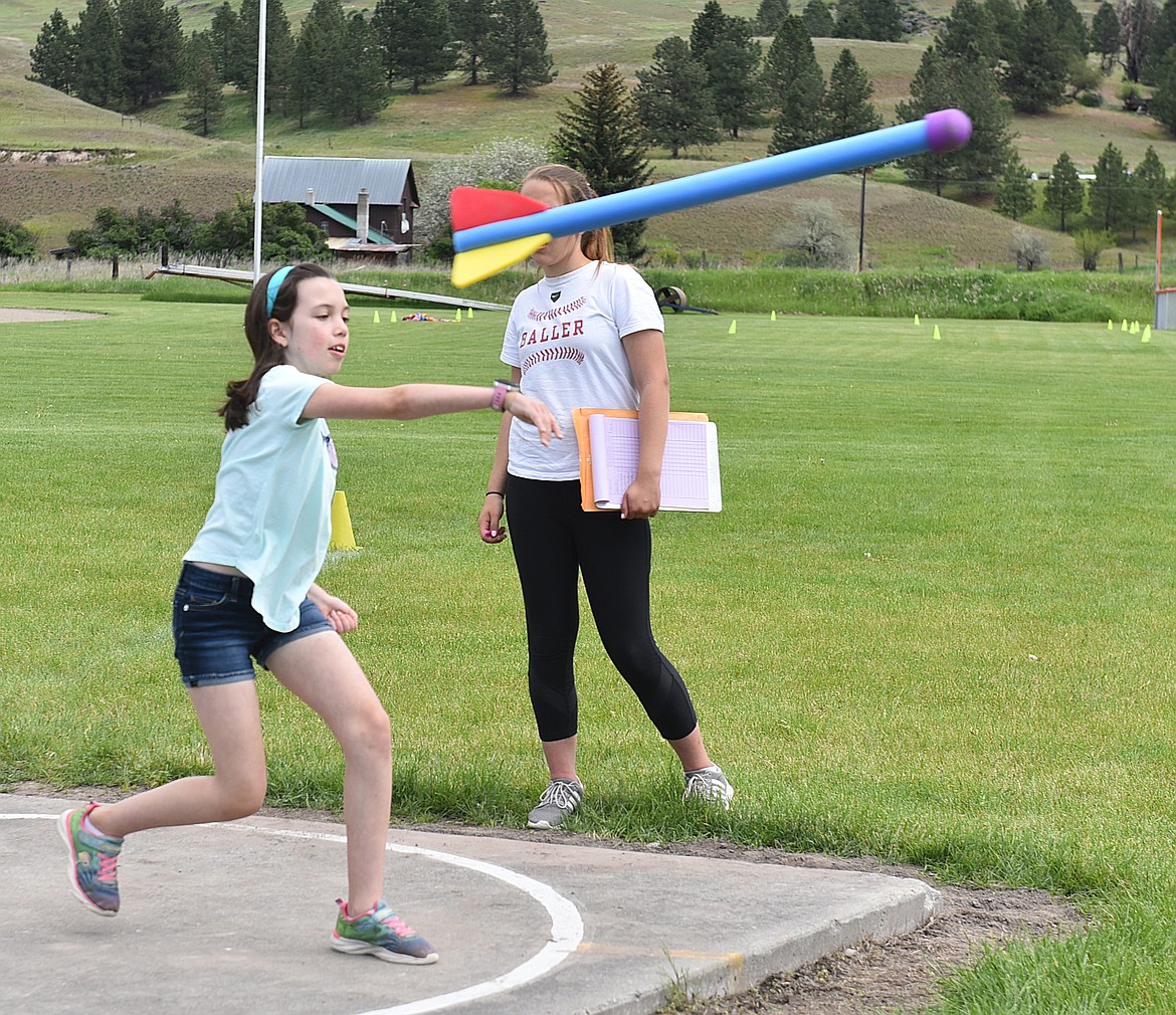 THIRD GRADER Mika Schulze gives the &#147;turbo javelin&#148; a heave during Track and Field Day activities on May 21 in Plains.