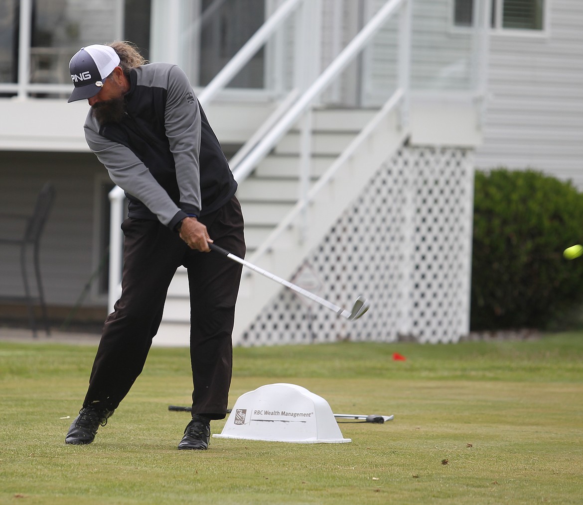 Billy Bomar hits his tee shot on the 17th hole during the third round of the Lilac City Invitational at The Fairways.