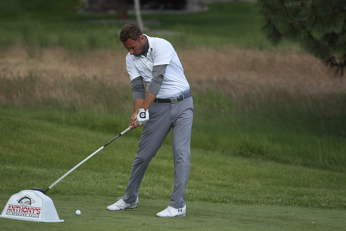 Russell Grove hits his tee shot on the 18th hole in the third round of the Lilac City Invitational at The Fairways.