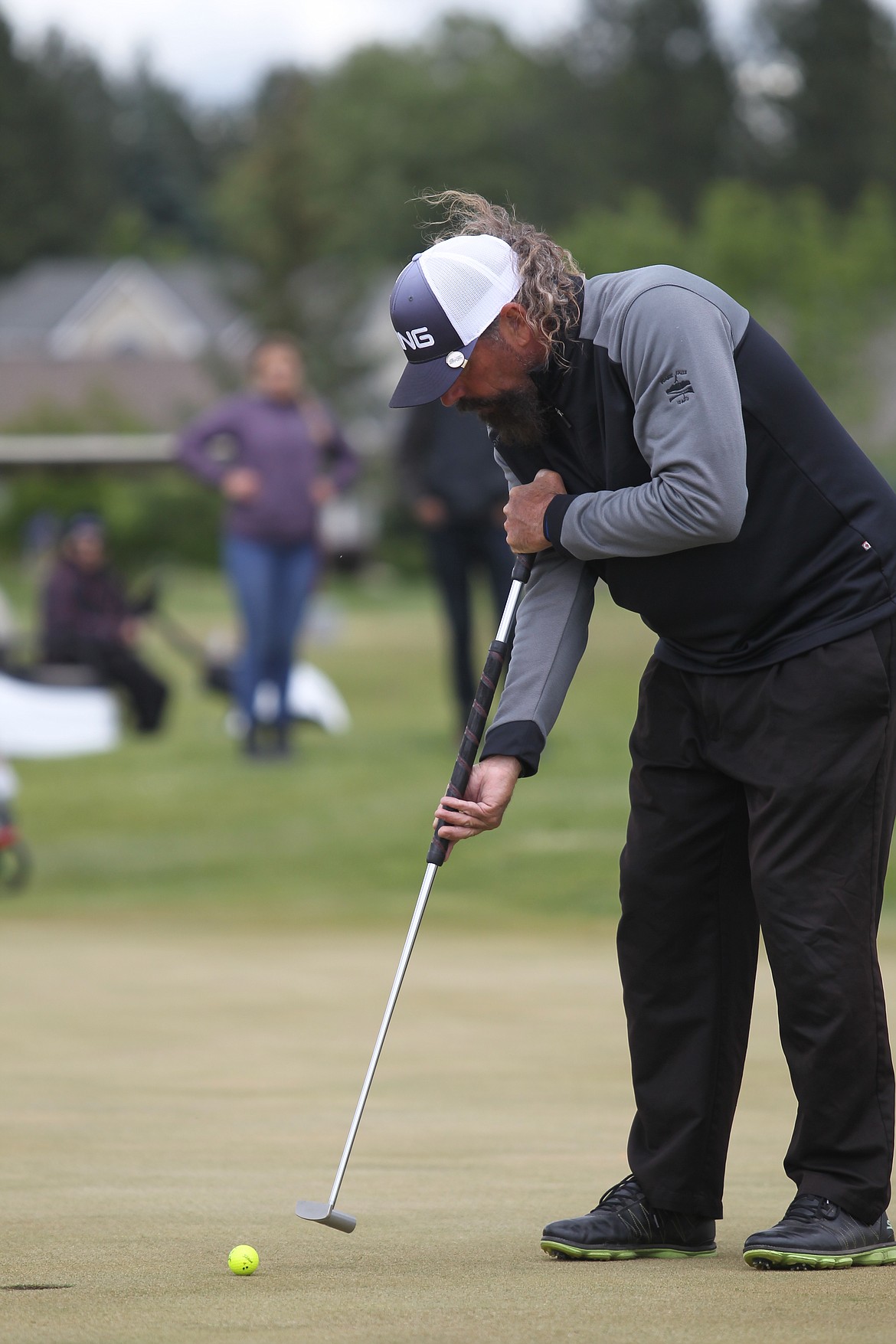 Billy Bomar, co-owner of Prairie Falls Golf Course in Post Falls, uses his side-saddle method to putt on the 13th hole Saturday in the third round of the Lilac City Invitational at The Fairways at West Terrace.