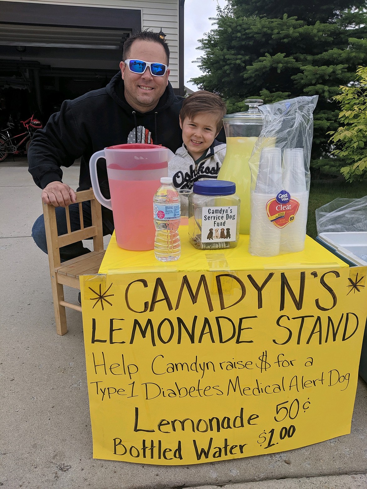 Camdyn Thompson and his father Wade Thompson.  COURTESY PHOTO