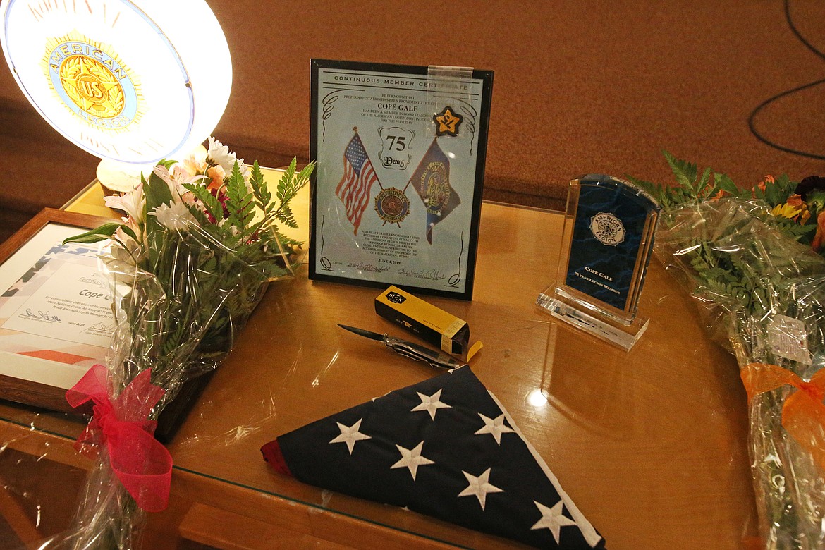 Cope Gale was presented with a 75 year American Legion pin, an American Flag that flew over the U.S. Capitol, a Buck Knife, and flowers to honor his wife and daughter. (LOREN BENOIT/Press)