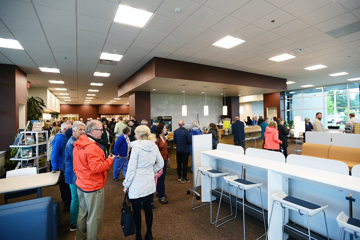Visitors tour Flathead Valley Community College&#146;s new Broussard Family Library and Learning Commons after a ribbon-cutting ceremony on Thursday. (Casey Kreider/Daily Inter Lake)