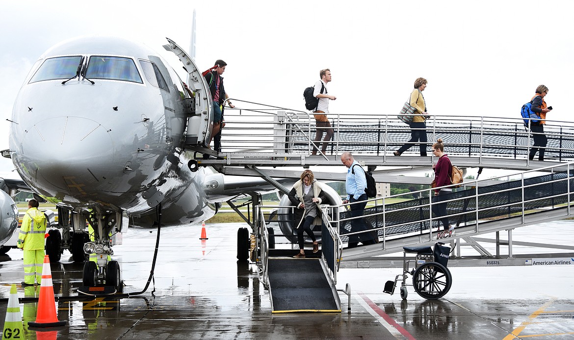 Passengers disembark from the American Airlines inaugural flight from Dallas/Fort Worth to Glacier Park International Airport on Thursday, June 6.(Brenda Ahearn/Daily Inter Lake)