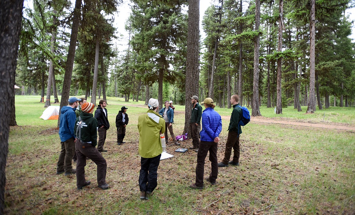 Members of the Montana Conservation Corps conduct a wilderness preparation class on Friday, May 24 at Camp Ponderosa. They were on sight to help with the clean up and revitalization of the property which is being turned into a veterans center by Allen and Linda Erickson of the Northwest Montana Veterans Food Pantry.(Brenda Ahearn/Daily Inter Lake)