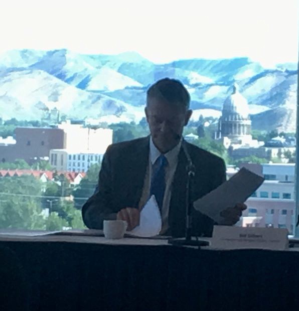 Gov. Brad Little looks over his notes before the start of Monday's task force meeting.