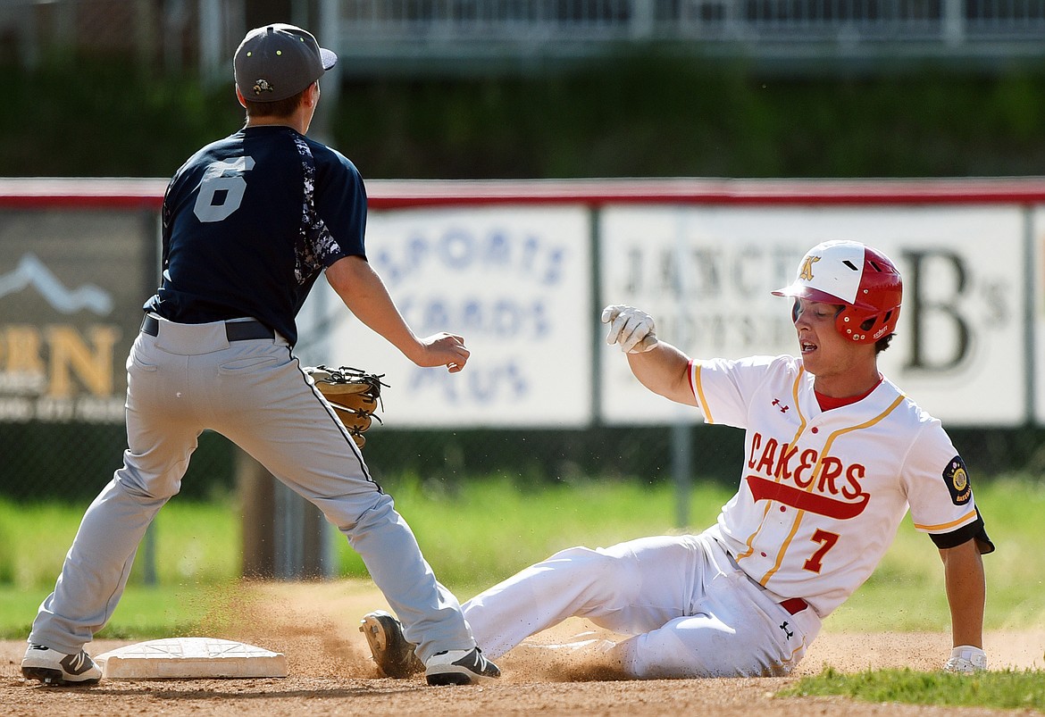 Kalispell's Randy Stultz slides into second base after a leadoff double in the bottom of the first against Mission Valley Mariners A at Griffin Field on Wednesday. (Casey Kreider/Daily Inter Lake)