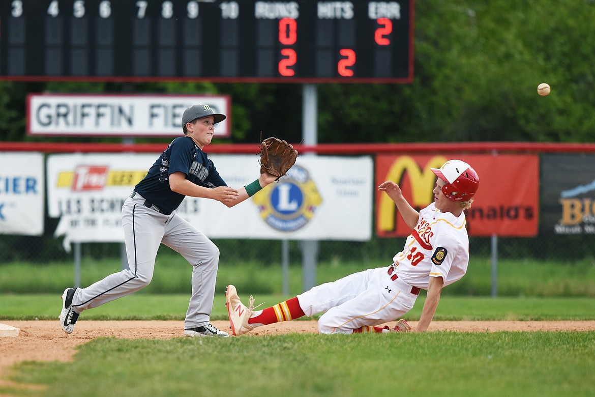 Kalispell's Connor Drish slides into second ahead of the throw on a stolen base attempt in the bottom of the second against Mission Valley Mariners A at Griffin Field on Wednesday. At second for Mission Valley is Espn Fisher. (Casey Kreider/Daily Inter Lake)