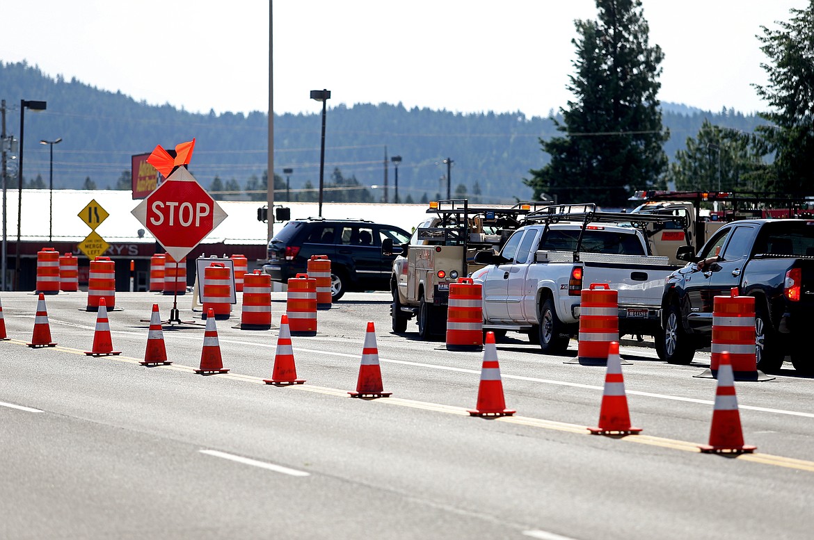 Motorists come to a stop at the intersection of U.S. 95 and Kathleen Avenue Monday. According to Coeur d&#146;Alene Police, an impaired driver struck one of the traffic light poles at the intersection, causing significant damage to the light. The driver was arrested. At this time, vehicles traveling on Kathleen will not be able to cross U.S. 95. (LOREN BENOIT/Press)