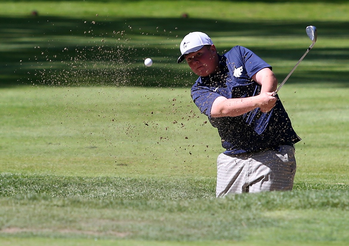 Lake City High&#146;s Alex Barrett hits a golf ball out of a sand trap on the second hole during the 5A Region 1 tournament May 6 at the Coeur d&#146;Alene Golf Club.