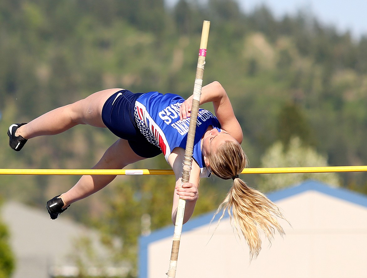 Coeur d&#146;Alene&#146;s Alex Bennett successfully clear the bar in the pole vault at the 5A Region 1 track and field meet May 9 at Coeur d&#146;Alene High School.