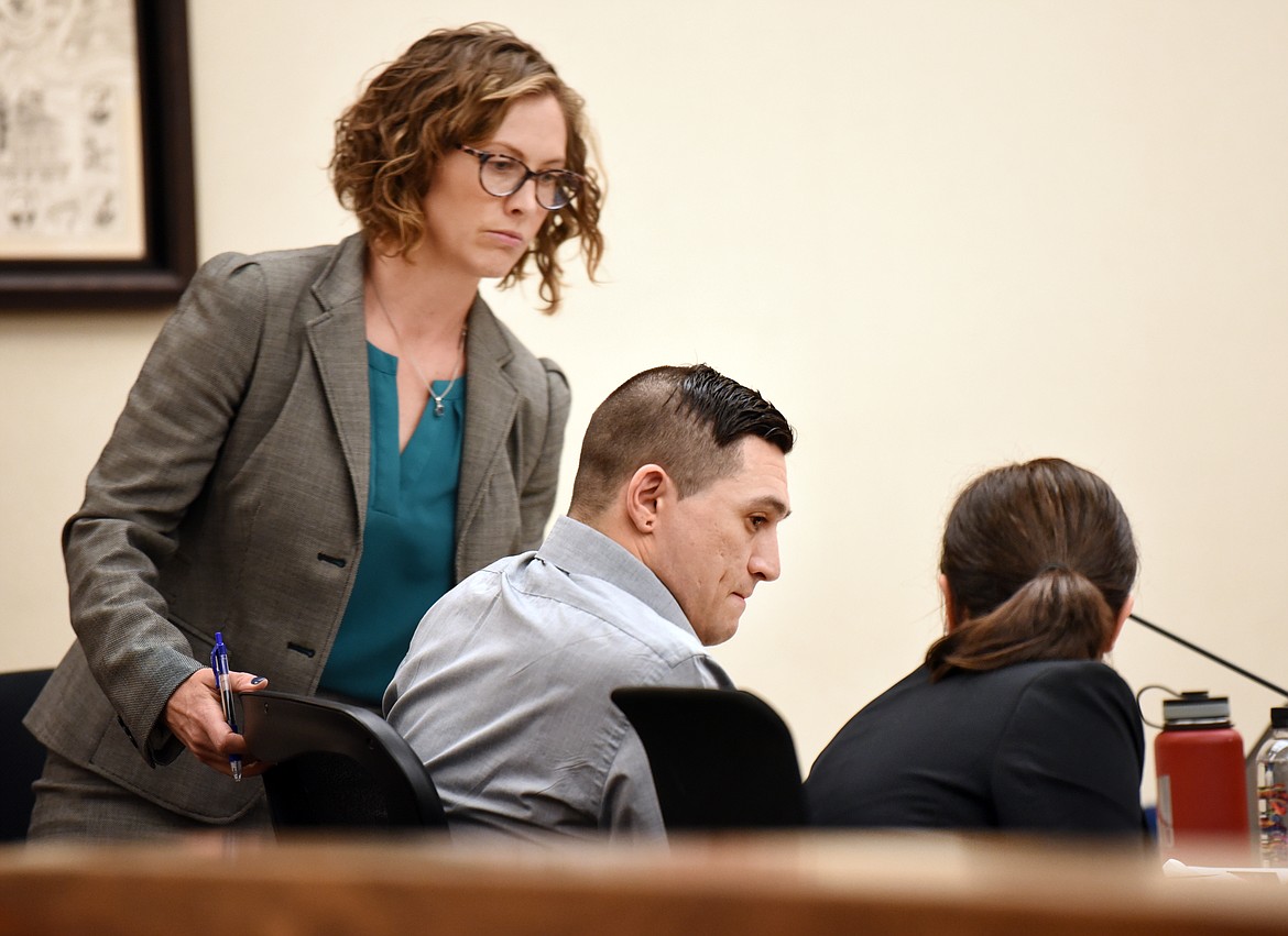 Ryan Cody Lamb with his defense team on Tuesday, June 4, at the Flathead County District Court. Lamb has been charged with felony deliberate homicide after being accused of stabbing his partner Ryan Nixon on Aug. 5, 2018. His trail began Monday.(Brenda Ahearn/Daily Inter Lake)