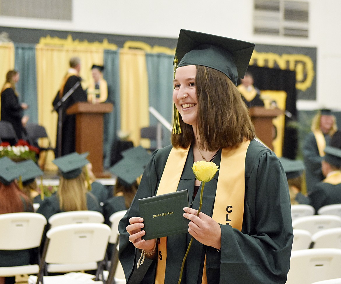 Graduate Lilly Butts smiles after receiving her diploma Saturday during the commencement ceremony for the Whitefish High School Class of 2019 in the school gym. There were 96 seniors who received their diplomas. (Heidi Desch/Whitefish Pilot)