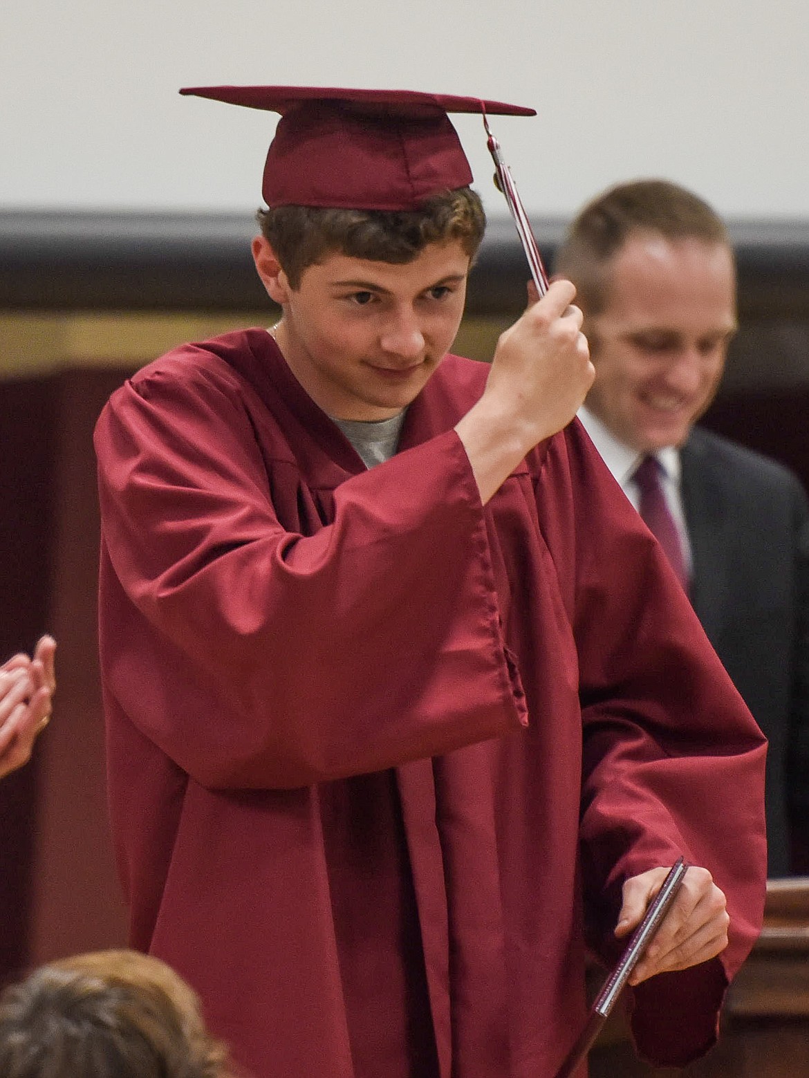 Troy High School&#146;s Hunter Leighty moves his tassel after receiving his diploma, Saturday at Troy&#146;s graduation. (Ben Kibbey/The Western News)