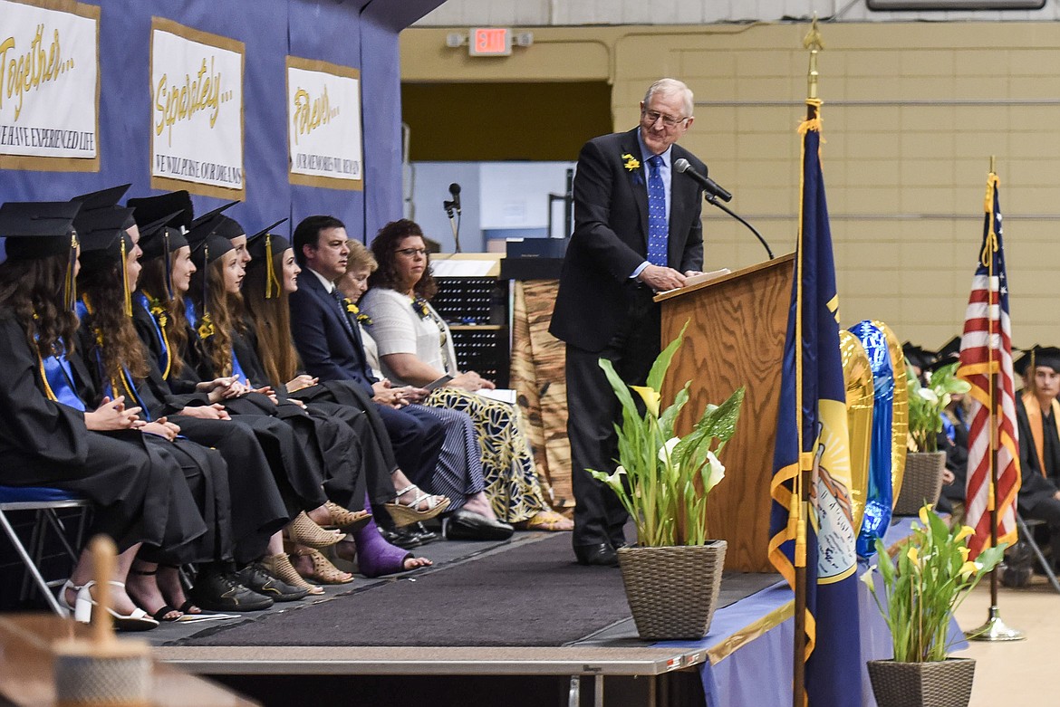 Commencement speaker Roe Hatlen addresses the Libby High School&#146;s valedictorians and salutatorian Saturday at Libby&#146;s graduation. (Ben Kibbey/The Western News)