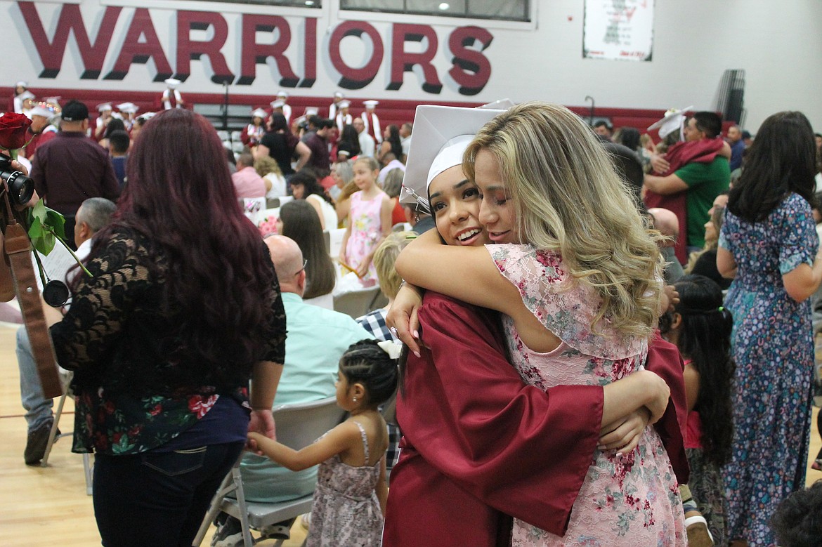 Rachal Pinkerton/Sun Tribune
A Wahluke graduate embraces a loved one after graduation over the weekend.