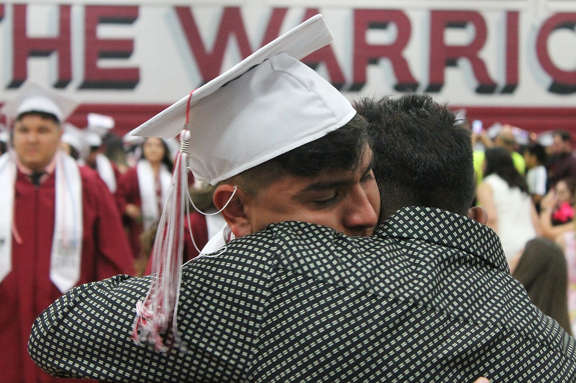 Rachal Pinkerton/Sun Tribune
A Wahluke graduate embraces a loved one after graduation over the weekend.