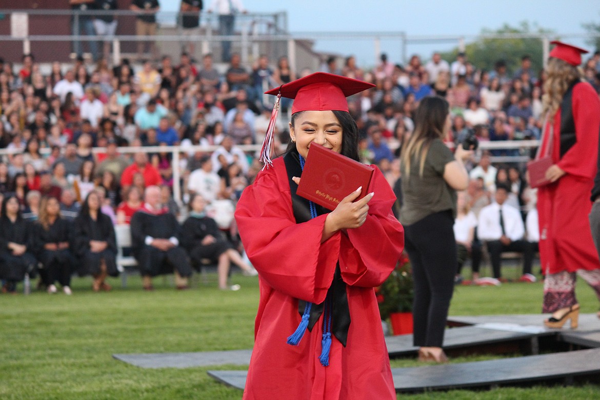 Cheryl Schweizer/Sun Tribune
An Othello High School graduate shows off her diploma.