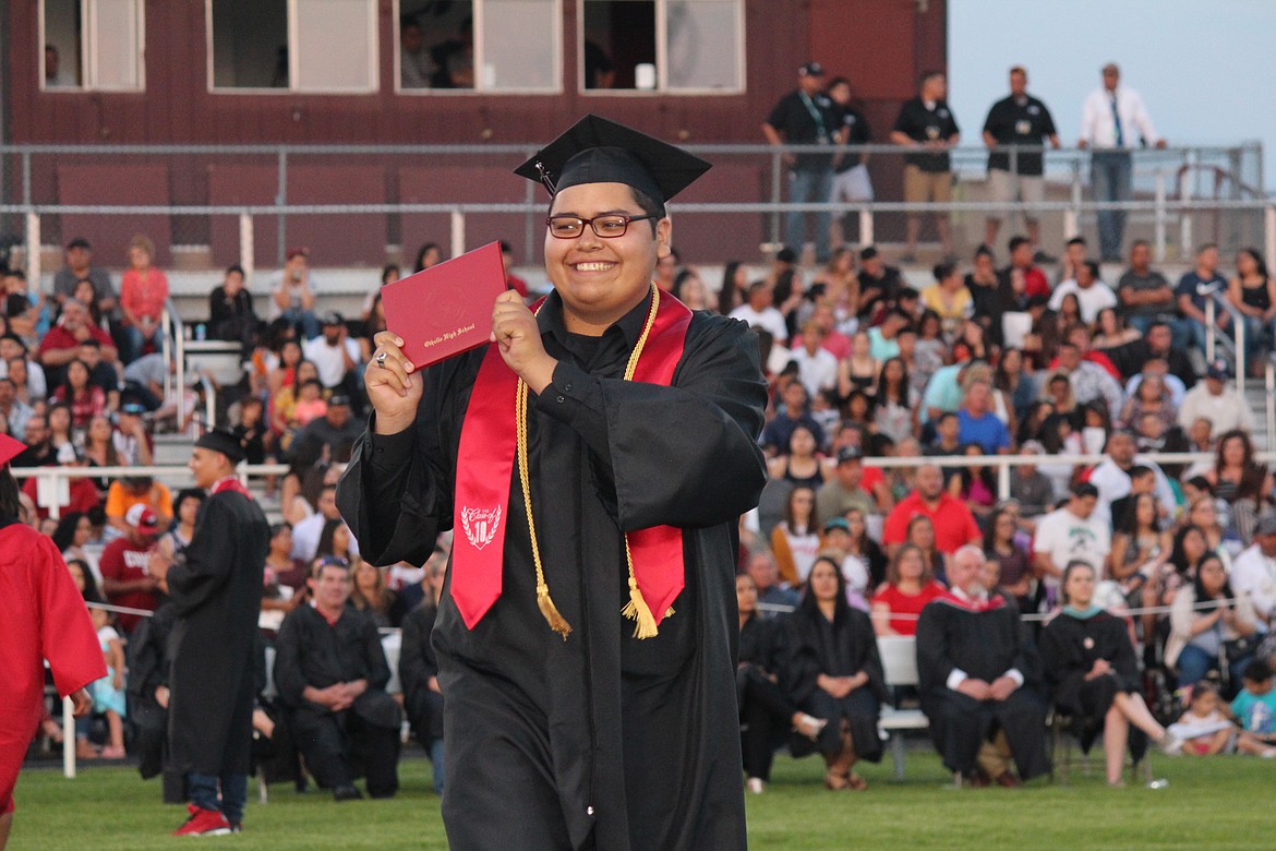 Cheryl Schweizer/Sun Tribune
An Othello student proudly displays his diploma.