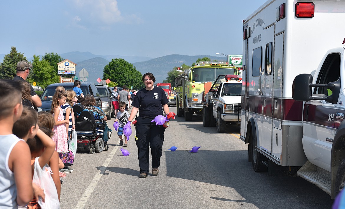 EMERGENCY MEDICAL technicians, or EMTs, were all smiles during the Plains Day Parade down Main Street Saturday. (Carolyn Hidy photos/Clark Fork Valley Press)